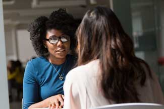 thumbnail woman wearing blue top beside table 1181712.jpg